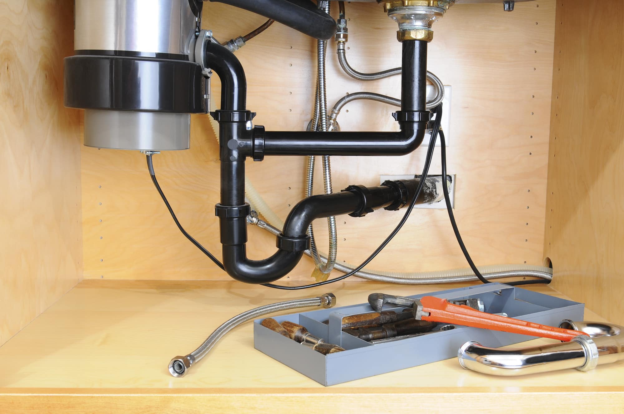 kitchen sink plumbing with dishwasher and garbage disposal